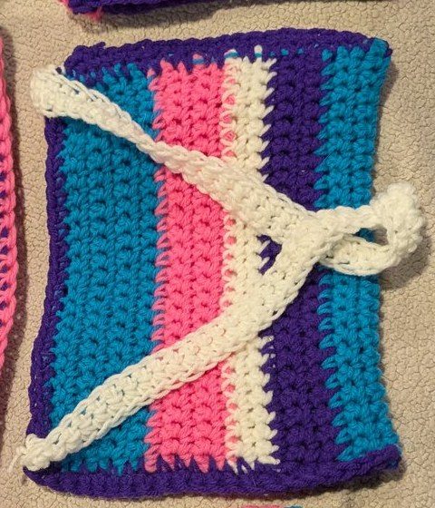 Striped crochet purse with white drawstring ties