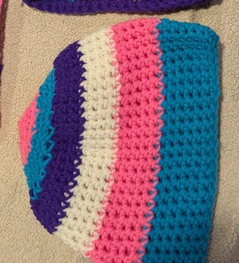 Crochet hat in wide pink, teal, white and purple stripes